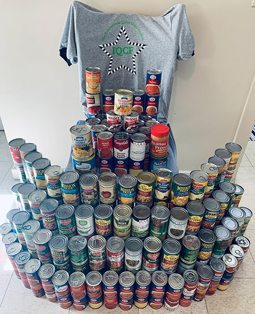 Photo of a large stack of canned food that was donated to the Circle Pantry